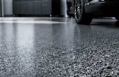 Close-up of a dense grey flake floor with a high-gloss topcoat